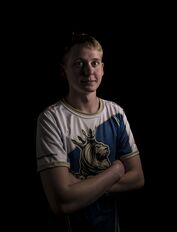 AMS posing with Crowns eSports Club's jersey.